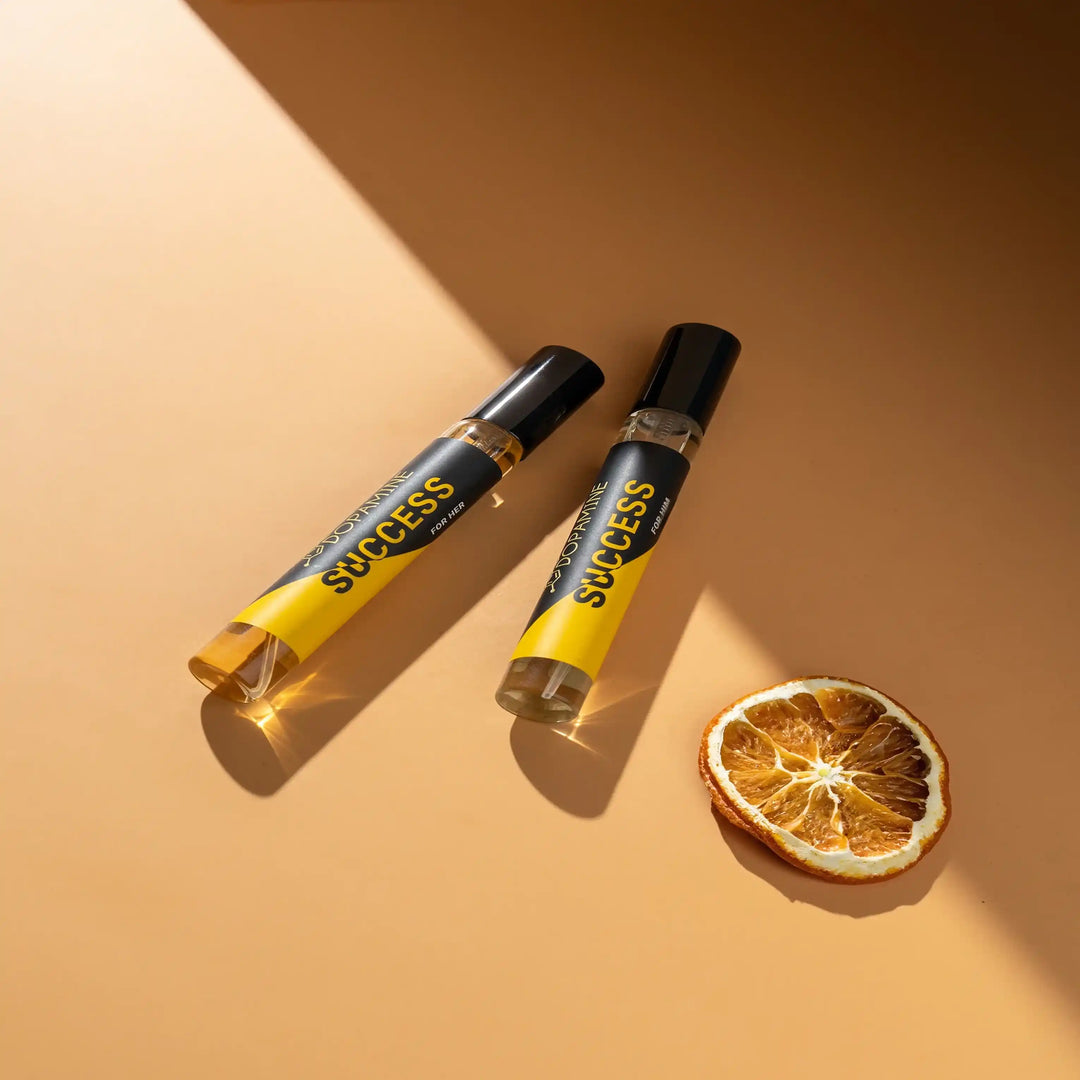 Success perfume set with dried orange slice