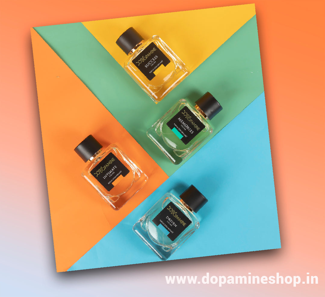 Flatlay Image of four Dopamine Perfumes Bottles for him artistically placed on a colored square 