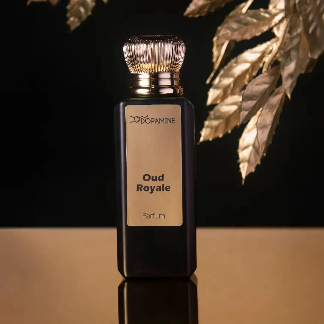 Oud Royale perfume bottle with golden leaves