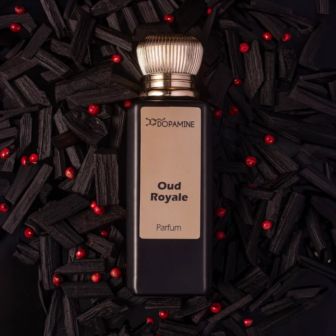 Oud Royale perfume bottle with black wood and red beads